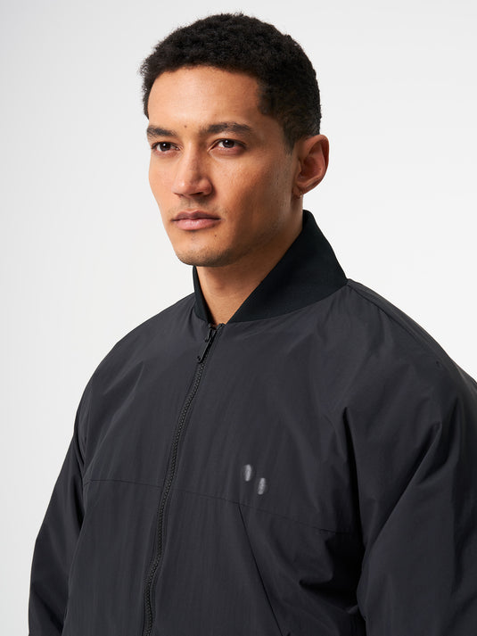 Pinqponq Light Bomber Jacket - Peat Black (Unisex) Kostenloser Versand international